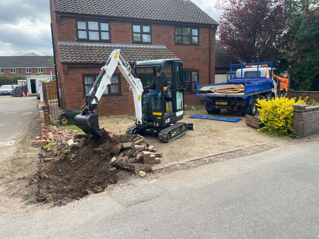 This is a photo of an operative of Sevenoaks Driveways Digging out for a new tarmac driveway