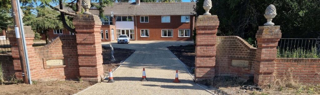 This is a photo of a newly installed chip and tar driveway, installed by Wisbech Driveways